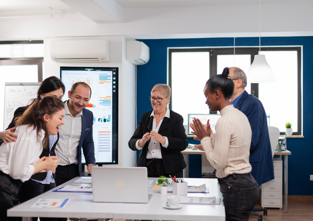 Team members participating in a leadership learning workshop focused on experience, social learning, and formal training with Pinnacle Paths.